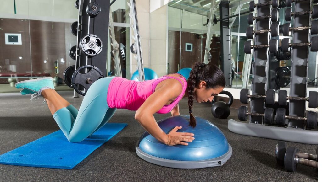 person doing Body Weight Chest Exercises on a bosu ball